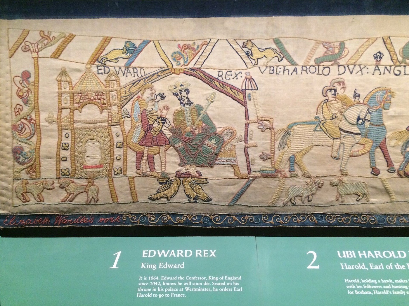 The Leek women's full-size copy, finished in 1886, in Reading Museum. Each stitcher's name runs under the section she made.