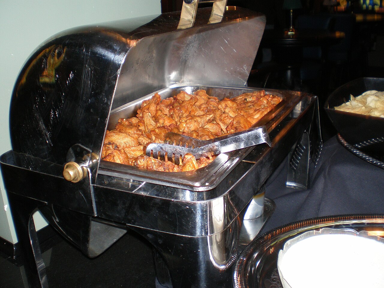 Buffalo wings at a buffet.