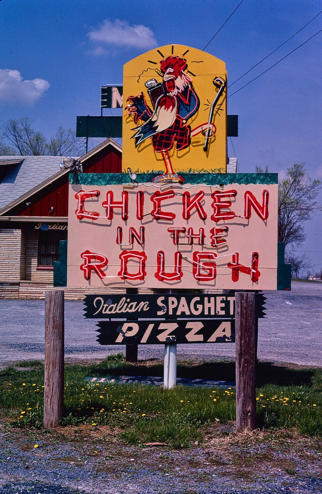 Title: Chicken In the Rough Restaurant sign, Route 11, New Market, Virginia
Physical description: 1 photograph : color transparency ; 35 mm (slide format).
Notes: Margolies categories: Eating and dr