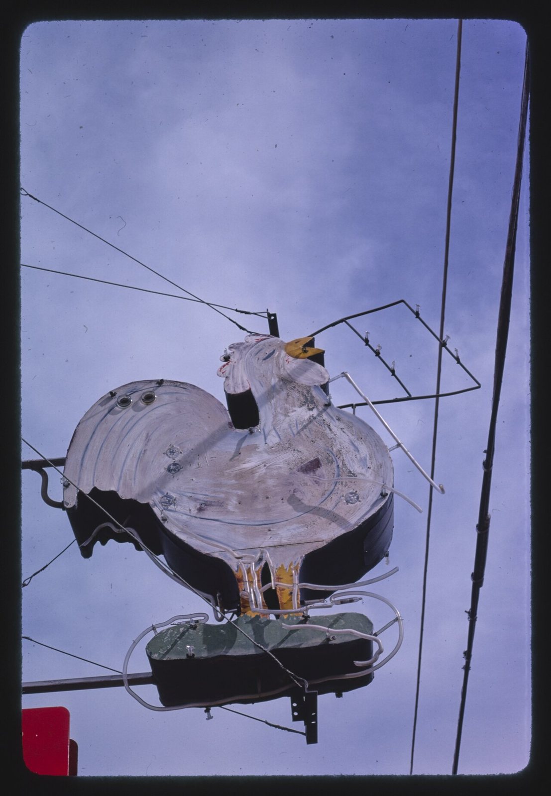 Title: Chicken sign, Routes 83 &amp; 50, Garden City, Kansas
Physical description: 1 photograph : color transparency ;  35 mm (slide format).

Notes: Margolies categories: Eating and drinking establis