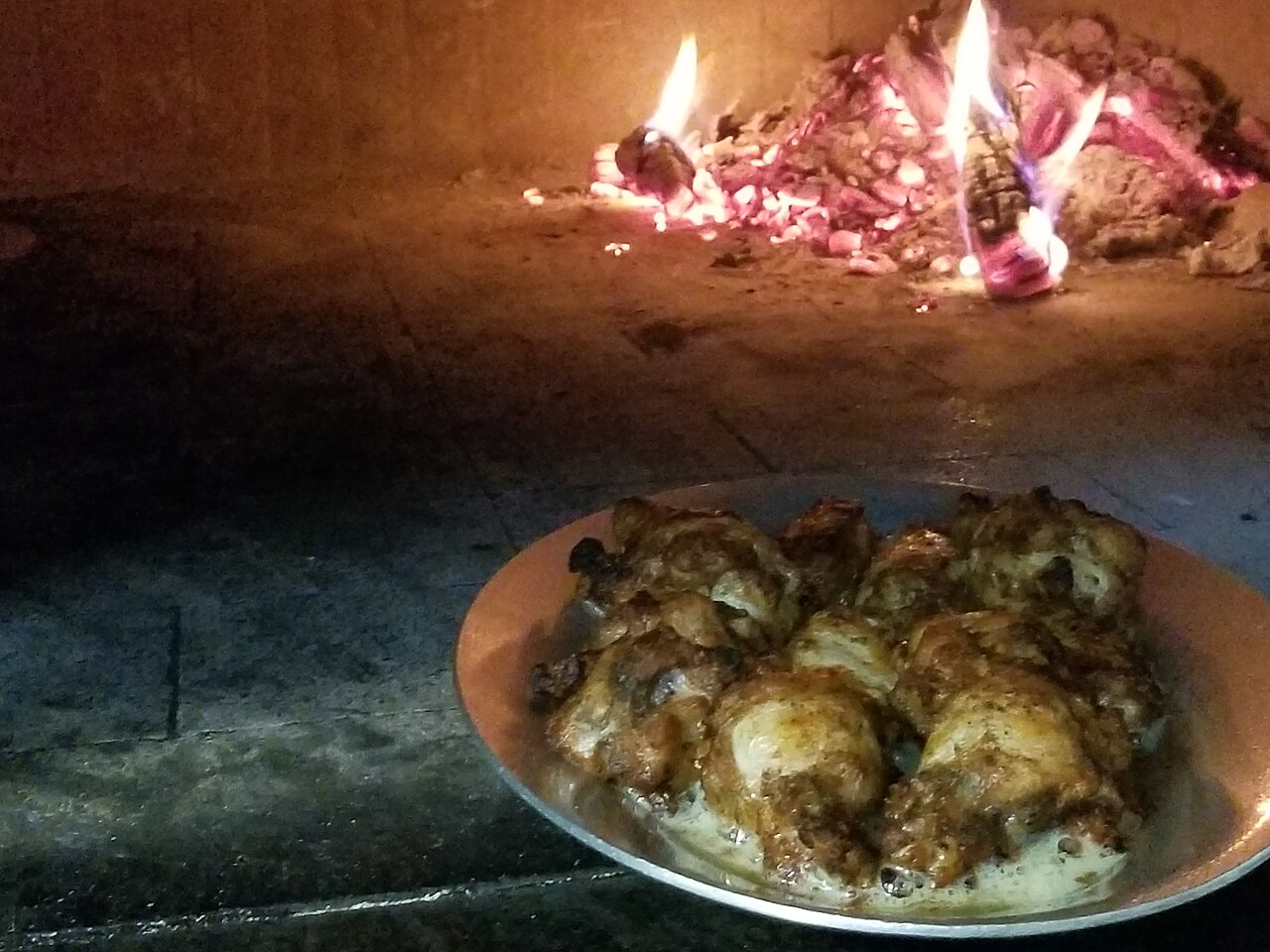 Chicken wings prepared in a wood burning pizza oven at Baronessa Italian Restaurant in Rockville, MD