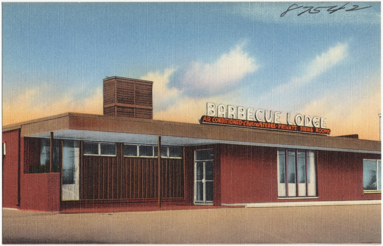 Linen postcard of the Barbecue Lodge, Fayetteville, North Carolina: a low red-brick building with a flat roof and a squat brick chimney, BARBECUE LODGE in lit letters along the parapet and a red strip beneath reading AIR CONDITIONED, Charcoal STEAKS, PRIVATE DINING ROOMS.