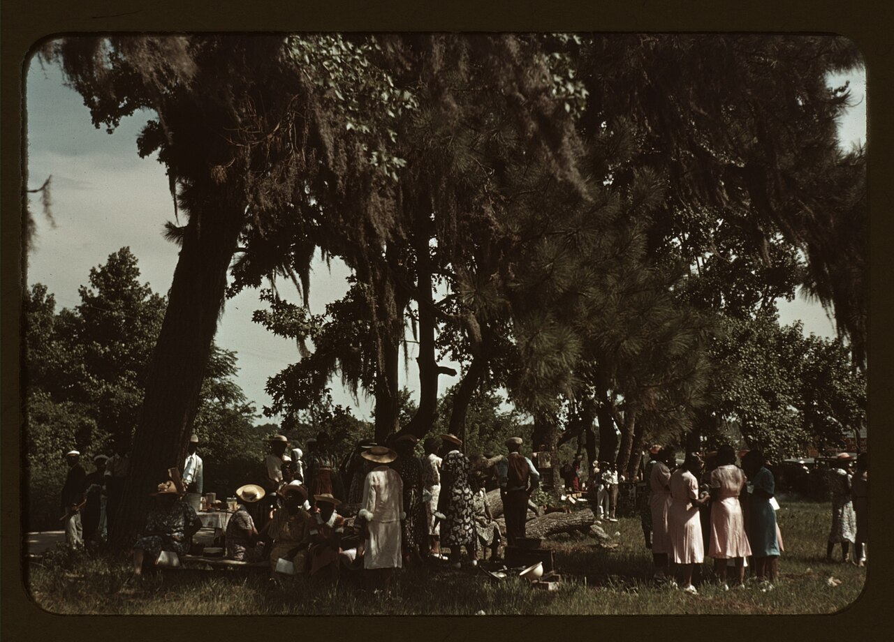 Colour transparency, 1939: people standing and talking at the Fourth of July celebration on St. Helena Island, South Carolina.