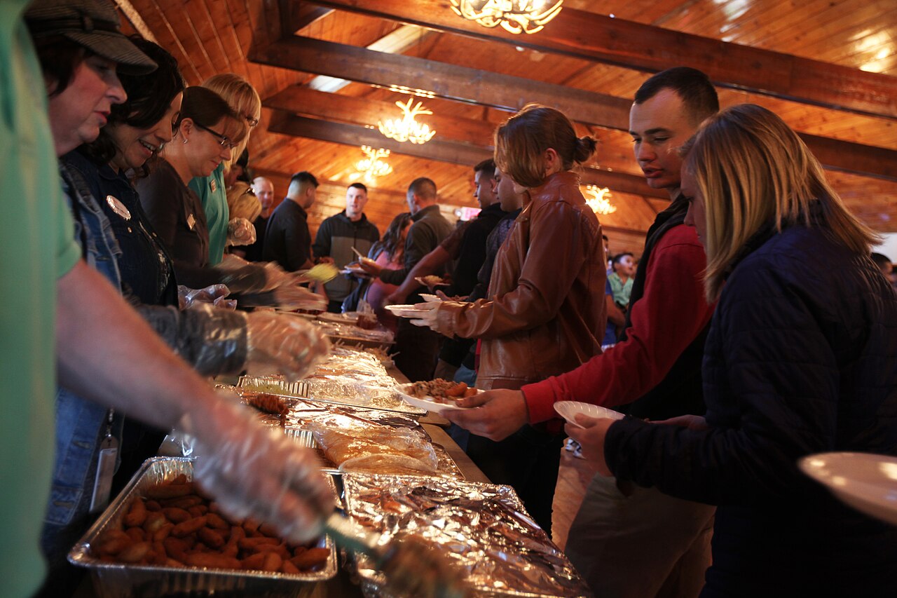 Members of the Havelock Military Affairs Committee serve Marines and families with Marine Attack Training Squadron 203 during the semi annual pig pickin’ at Marine Corps Air Station Cherry Point, N.C.
