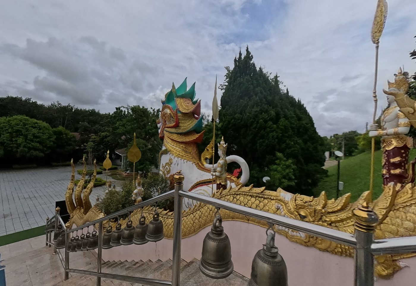 Naga stair with bells and a guardian lion (singha)