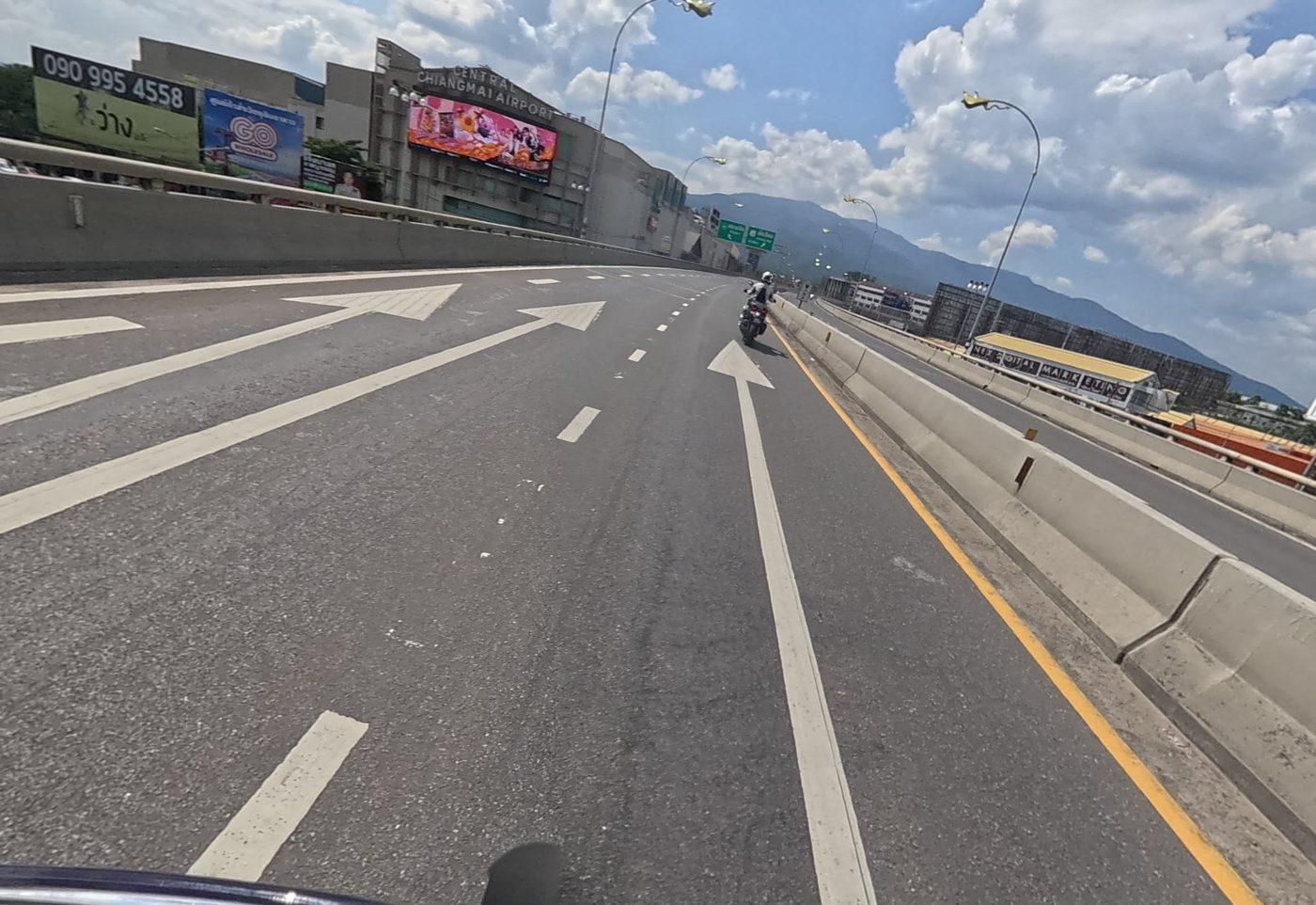 Flyover past Central Chiangmai Airport mall, with Doi Suthep behind