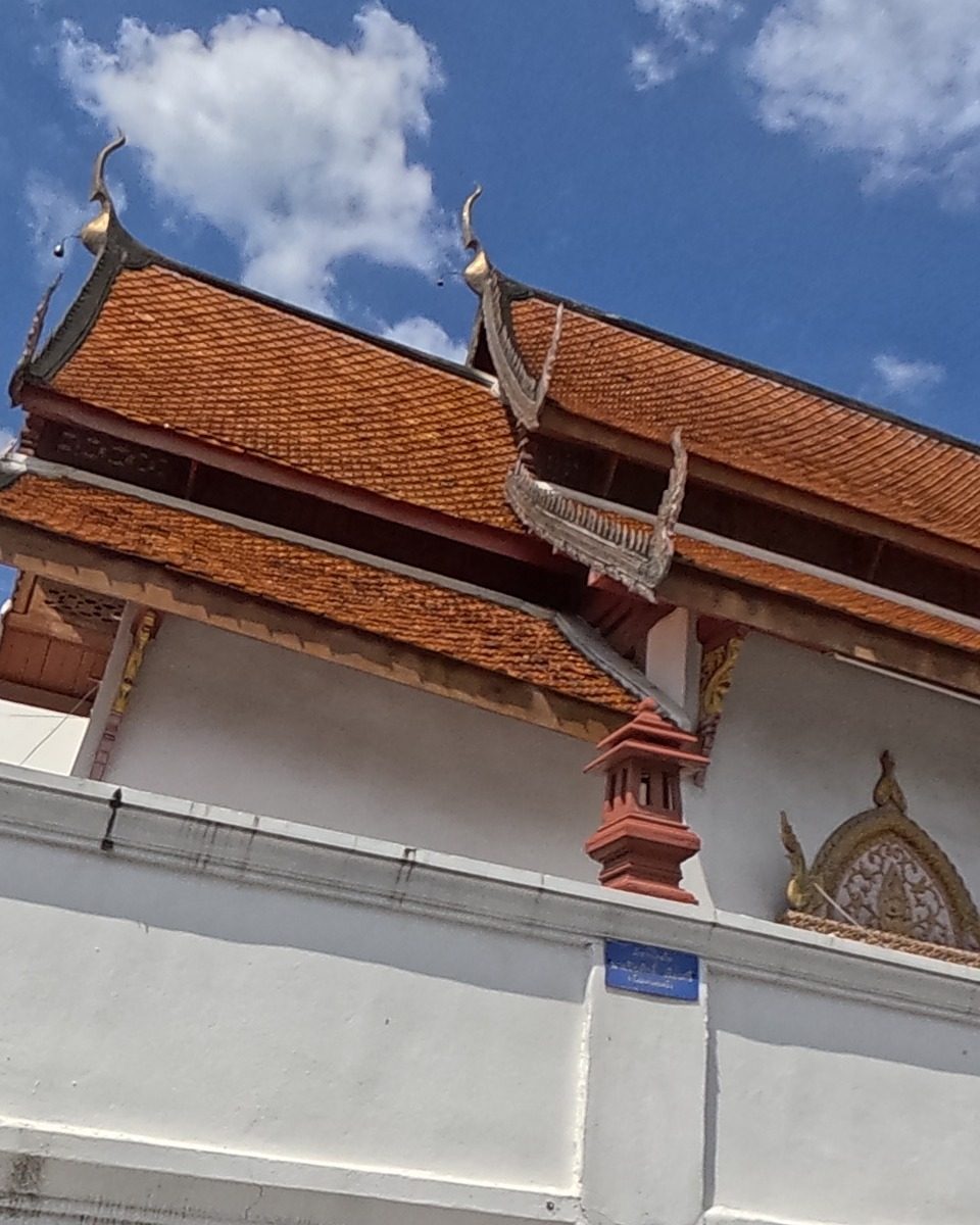 Wat Pha Bong's tiled viharn roof and gilded gable