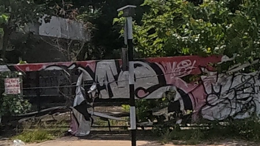 Colourful graffiti pieces on an abandoned building