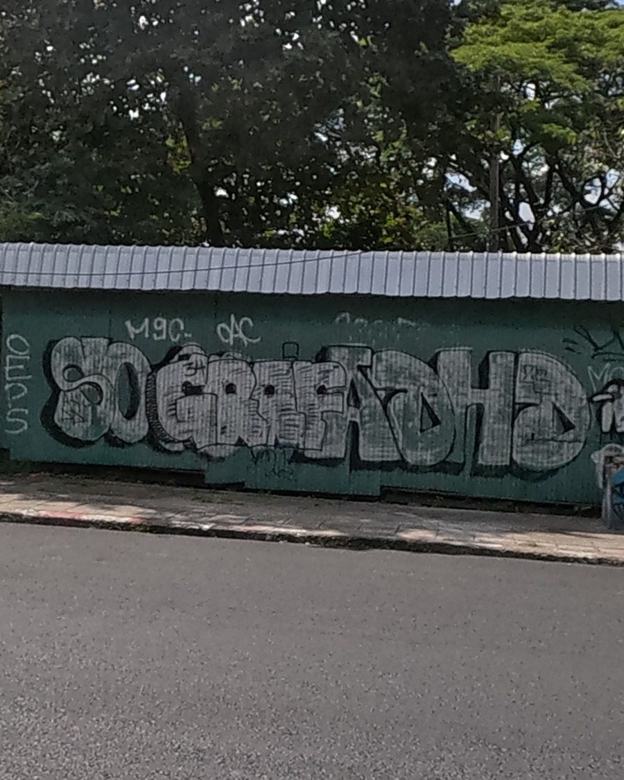 Large bubble-letter piece on a teal wall