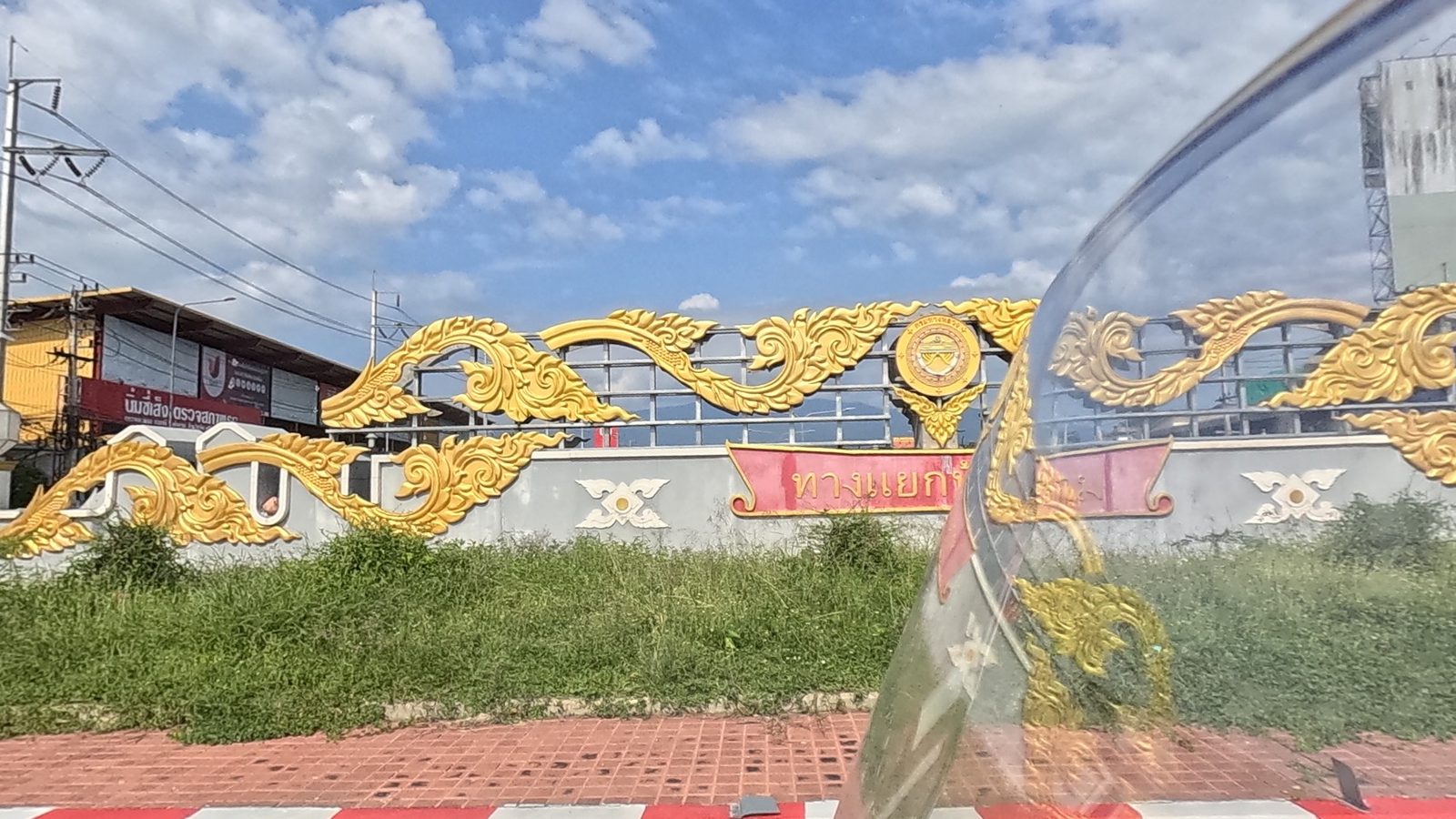 Golden Lanna scrollwork on the interchange gateway