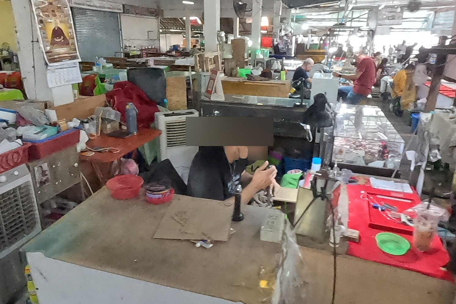 A craftsman casing an amulet