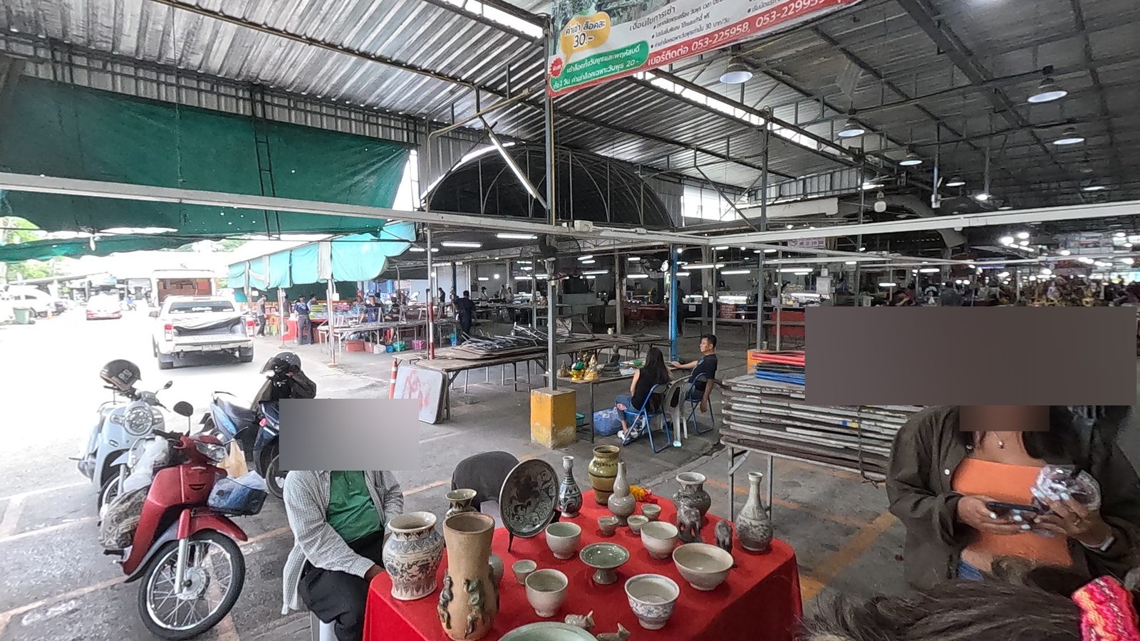 The Wednesday amulet market banner over the stalls