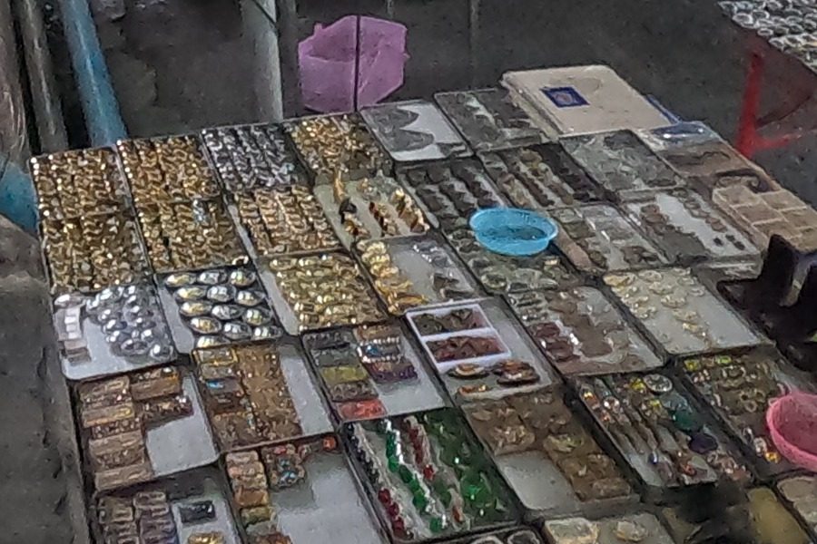 Trays of gold-framed amulets