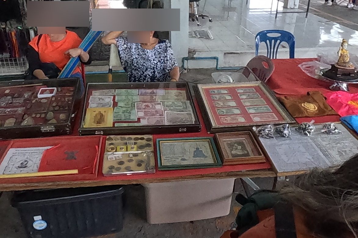 Old banknotes, coins and clay amulets