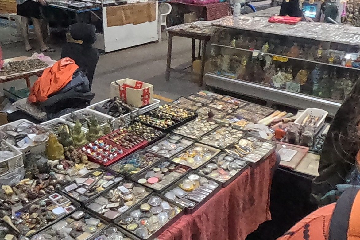 Trays of amulets, rings and beads