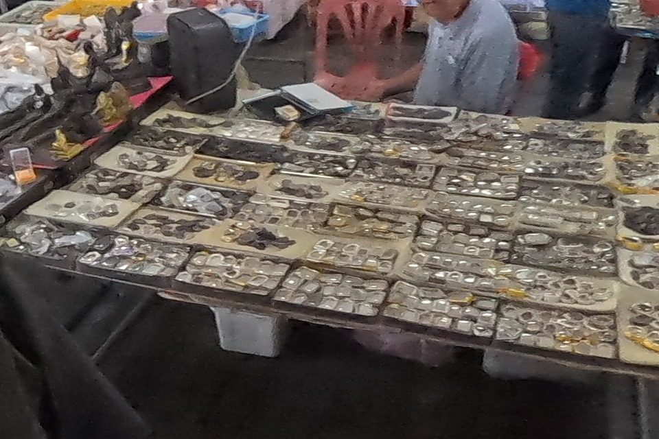 Coin amulets in rows