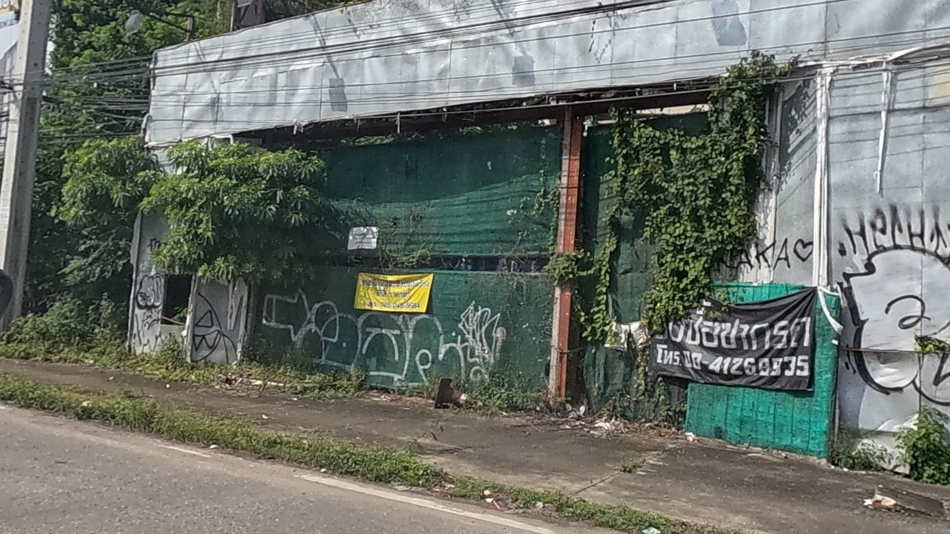 tagged shutters of an abandoned building