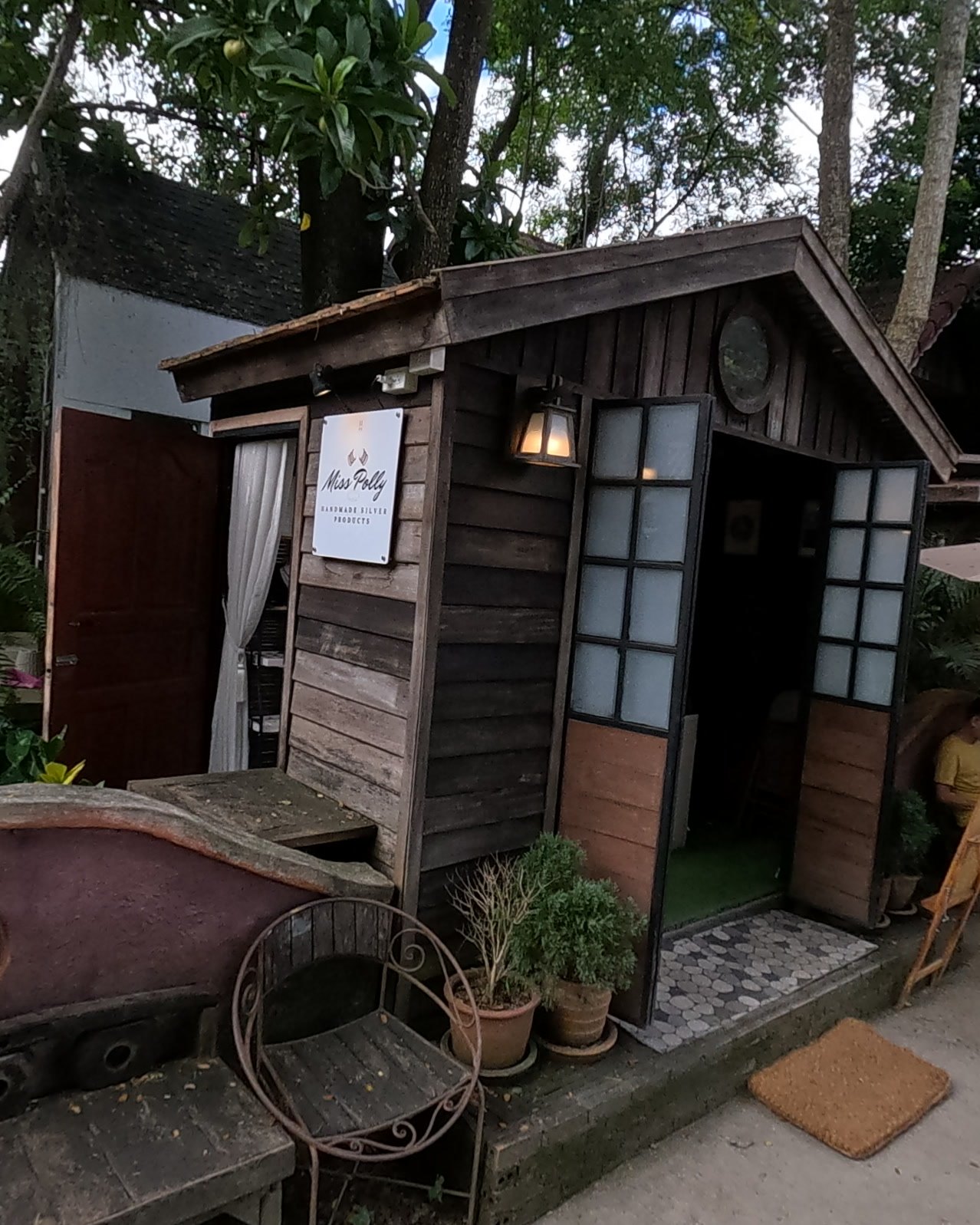 Miss Polly, a silver maker's wooden hut — Chamcha Market, San Kamphaeng