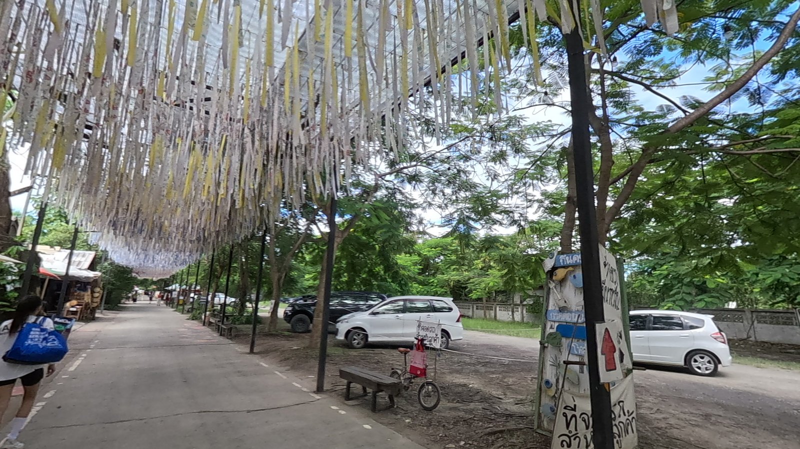 Paper streamers over the lane — Chamcha Market, San Kamphaeng