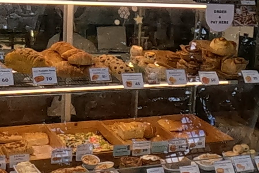 Pastry case at Pungpond Homemade Bakery — Chamcha Market, San Kamphaeng