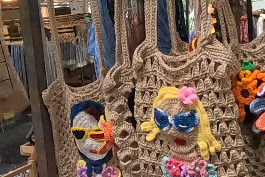 Crocheted tote bags with faces and flowers — Chamcha Market, San Kamphaeng