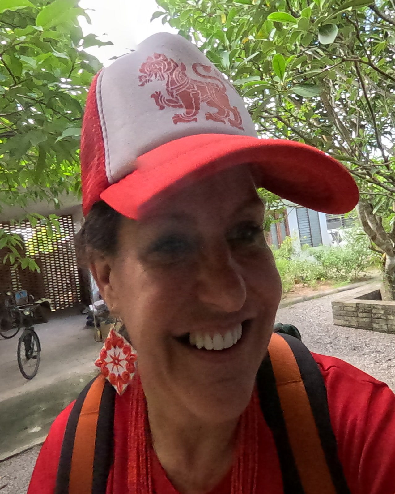 NaN smiling in the courtyard — Chamcha Market, San Kamphaeng