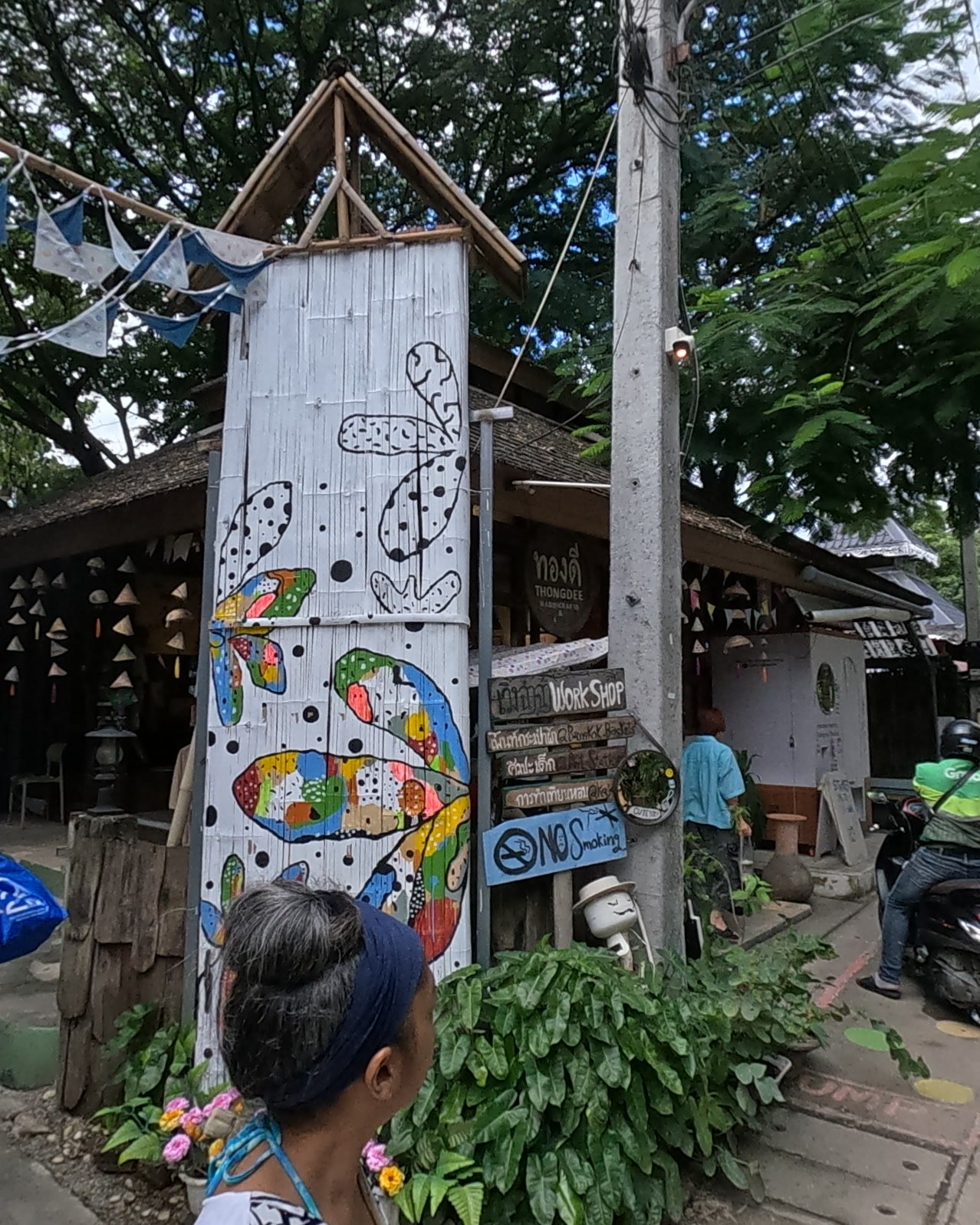 Bamboo post painted with butterflies — Chamcha Market, San Kamphaeng