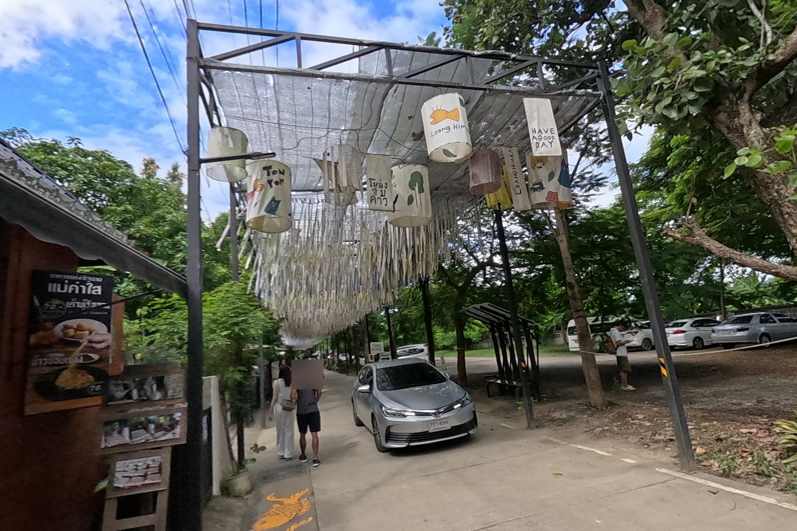 Loang Him Kao lanterns and ribbon canopy — Chamcha Market, San Kamphaeng