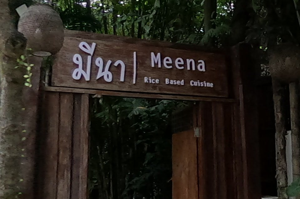 Meena's wooden gate sign — Chamcha Market, San Kamphaeng