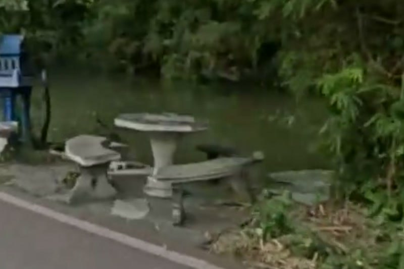 Canal-side picnic tables under bamboo — San Kamphaeng