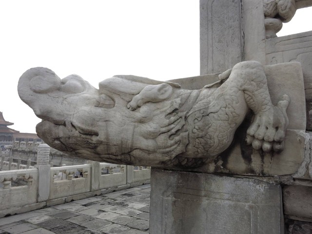 A close view of one marble chishou dragon-head drain spout on the terrace of the Hall of Supreme Harmony, Forbidden City, Beijing.