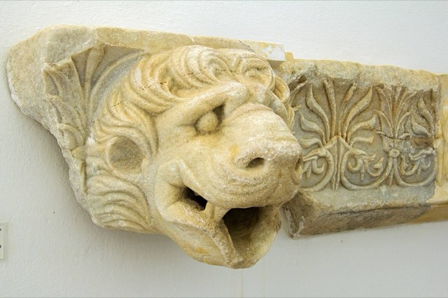 A marble lion-head waterspout set in a carved sima from the temple of Apollo Delios on Paros, late 5th century BC, in the Archaeological Museum of Paros.