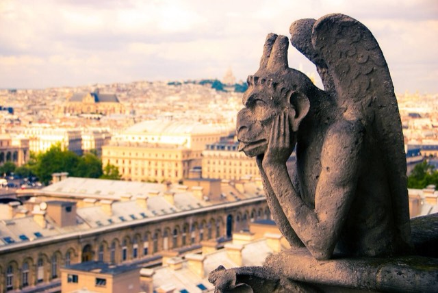Le Stryge, the horned and winged chimera resting its chin on its hands, gazing over the rooftops of Paris from the upper gallery of Notre-Dame de Paris.