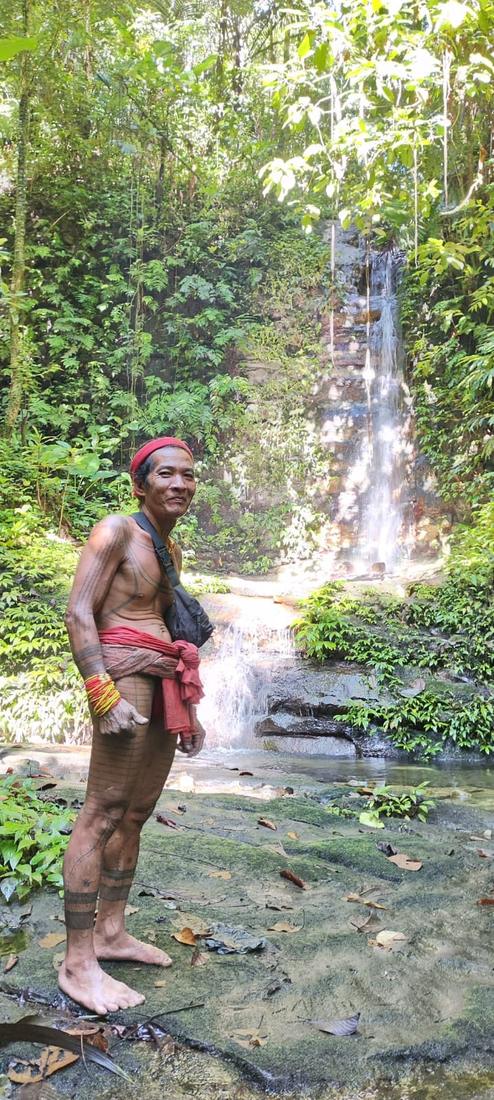 Portrait of a Sikerei (Mentawai shaman) displaying traditional full-body tattoos, Siberut Island.