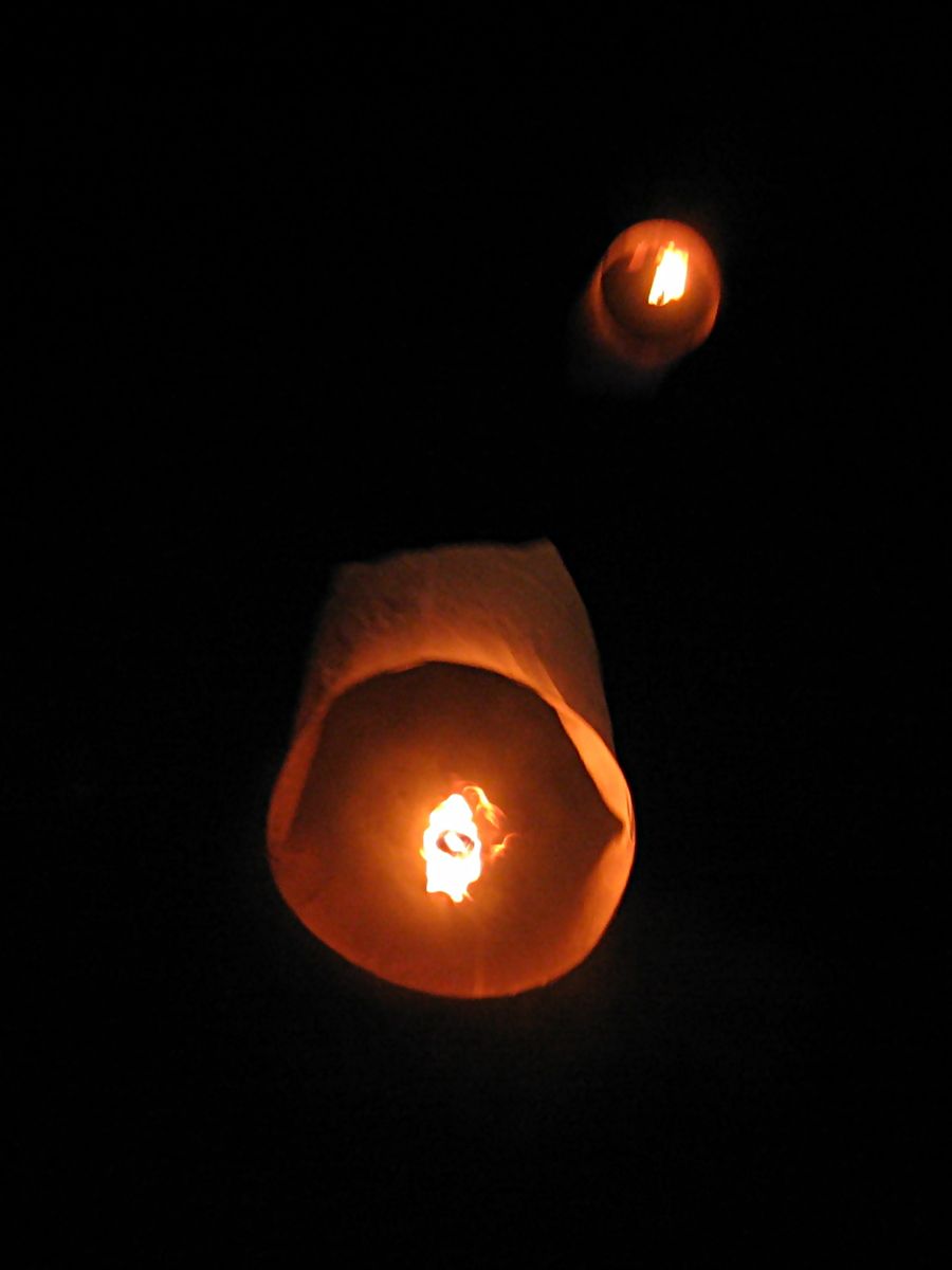 From underneath: the open mouth, the bamboo hoop and the burning fuel at the centre. Chiang Mai, 2006.