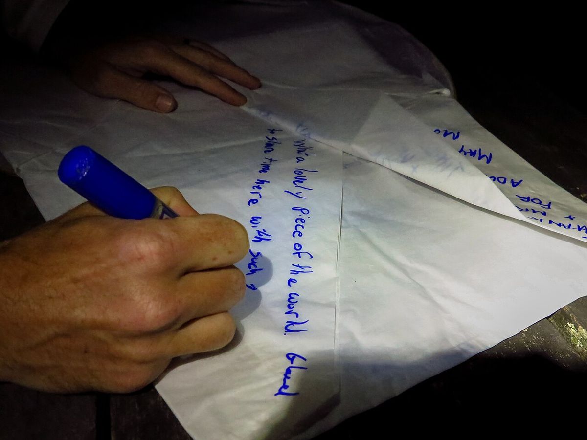 Writing on the paper before it goes up, 2016.