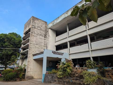 A three-story school building named "Sukhumbandhunirmit"