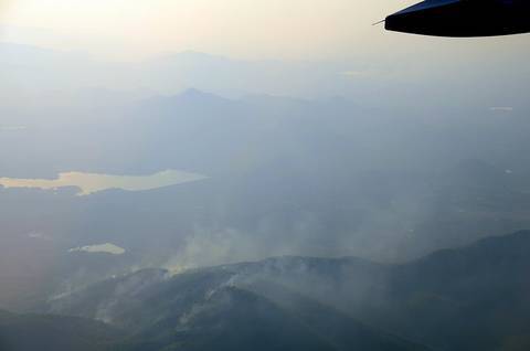 The photo shows the smoke coming off from several wildfires in the mountains of northern Thailand. Farmers in northern Thailand always set fire to the forests in the mountains nearing the end of the d