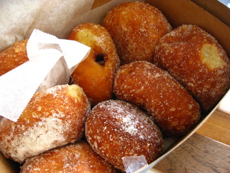 (Leonard's Bakery, Honolulu, Hawaii) we couldn't decide!, so ended up getting at least one of each of the flavor-filled (custard, chocolate, haupia, guava) malasadas, a cinnamon plain one, and an orig