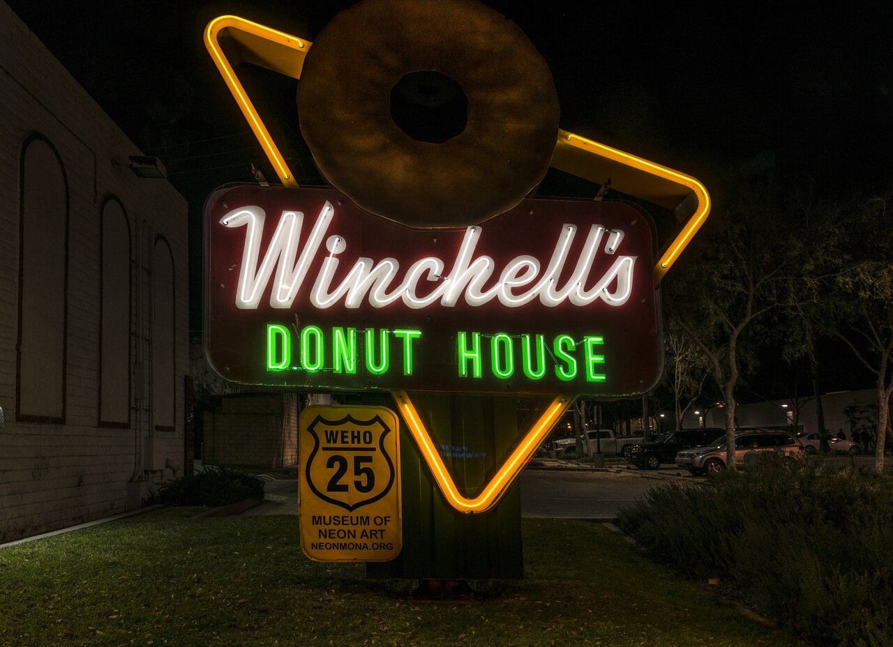 Title: Donut shop neon sign on Santa Monica Boulevard in West Hollywood, California
Physical description: 1 photograph : digital, tiff file, color.
Notes: Title, date, and keywords provided by the pho
