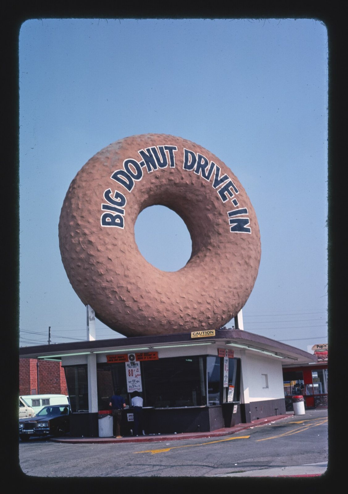 Title: Big Do-Nut Drive-in, Inglewood, California
Physical description: 1 photograph : color transparency ;  35 mm (slide format).

Notes: Forms part of: John Margolies Roadside America photograph arc