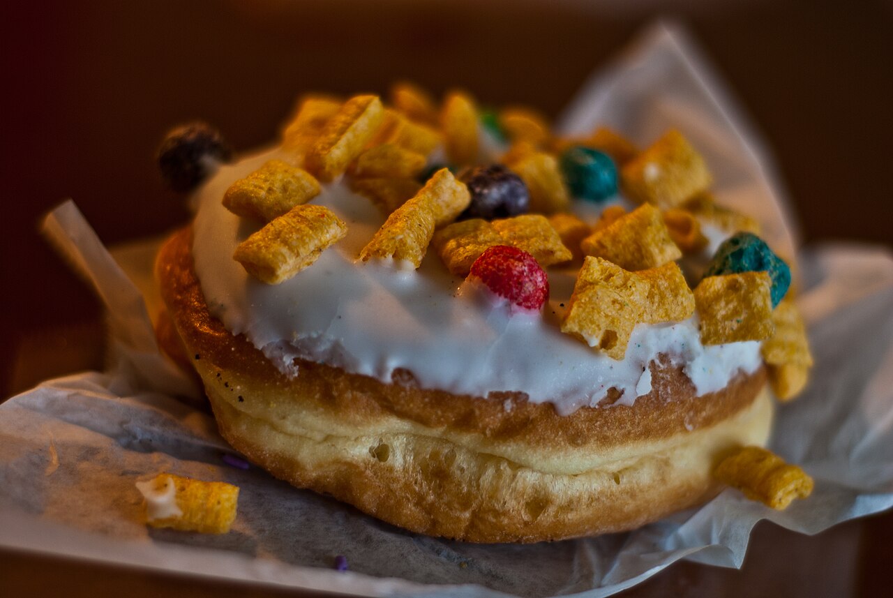 A "Captain my Captain" doughnut from Voodoo Doughtnut in Portland, Oregon, consisting of vanilla frosting and Cap'n Crunch cereal.