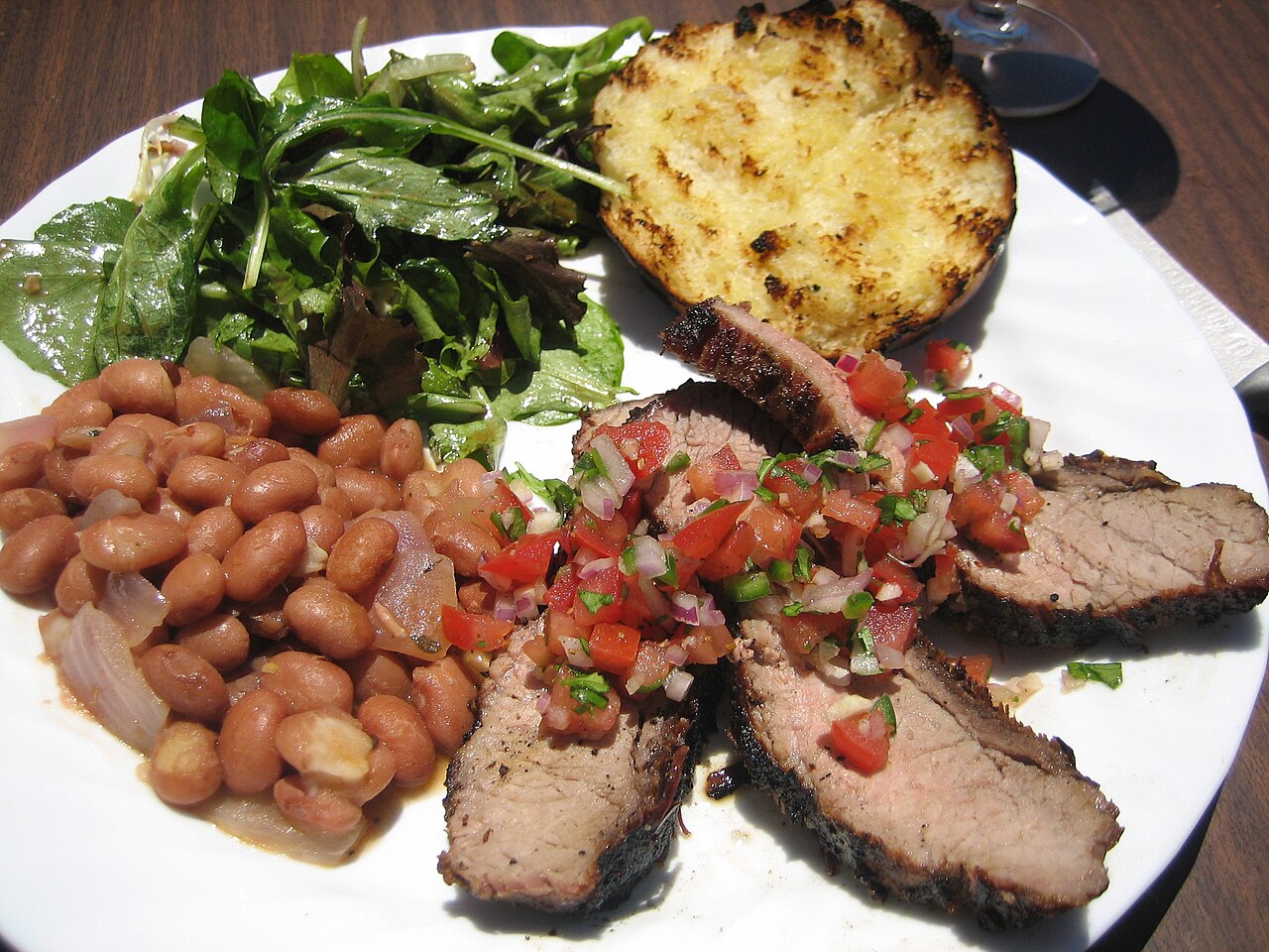 Santa Maria-style barbecue: Tri-tip with salsa, pink beans (can't get pinquitos outside of Santa Maria), salad, and garlic bread. Would have been nice if the meat were rarer, but it was still deliciou