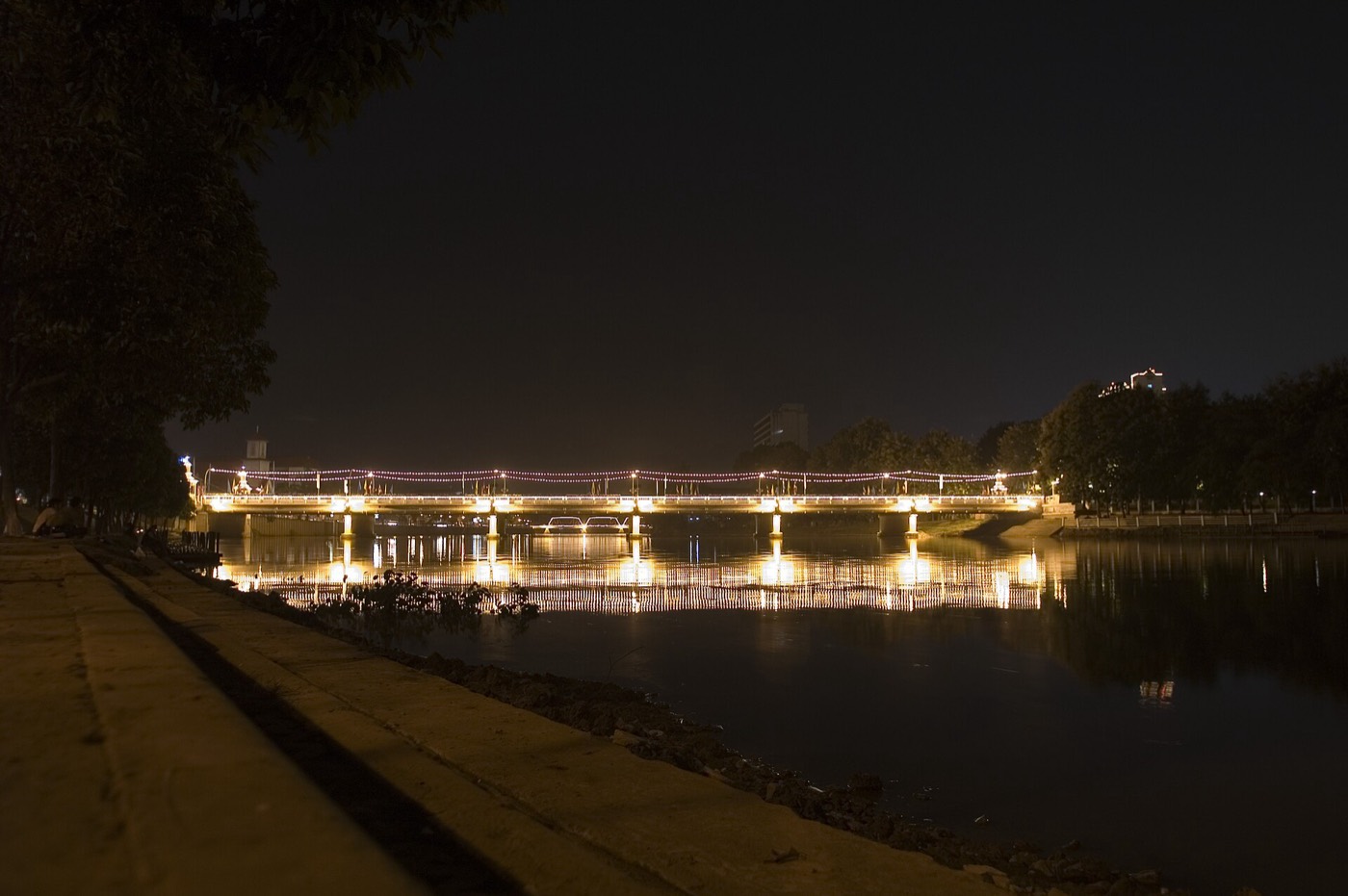 Nawarat Bridge lit at night over the Ping River