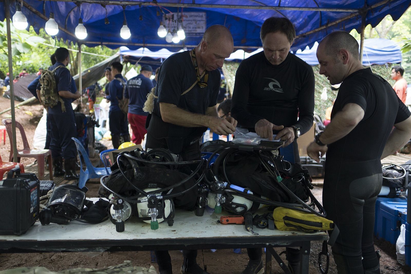2 July 2018: cave divers ready their gear at the camp by the cave. That night two of the divers found the team.